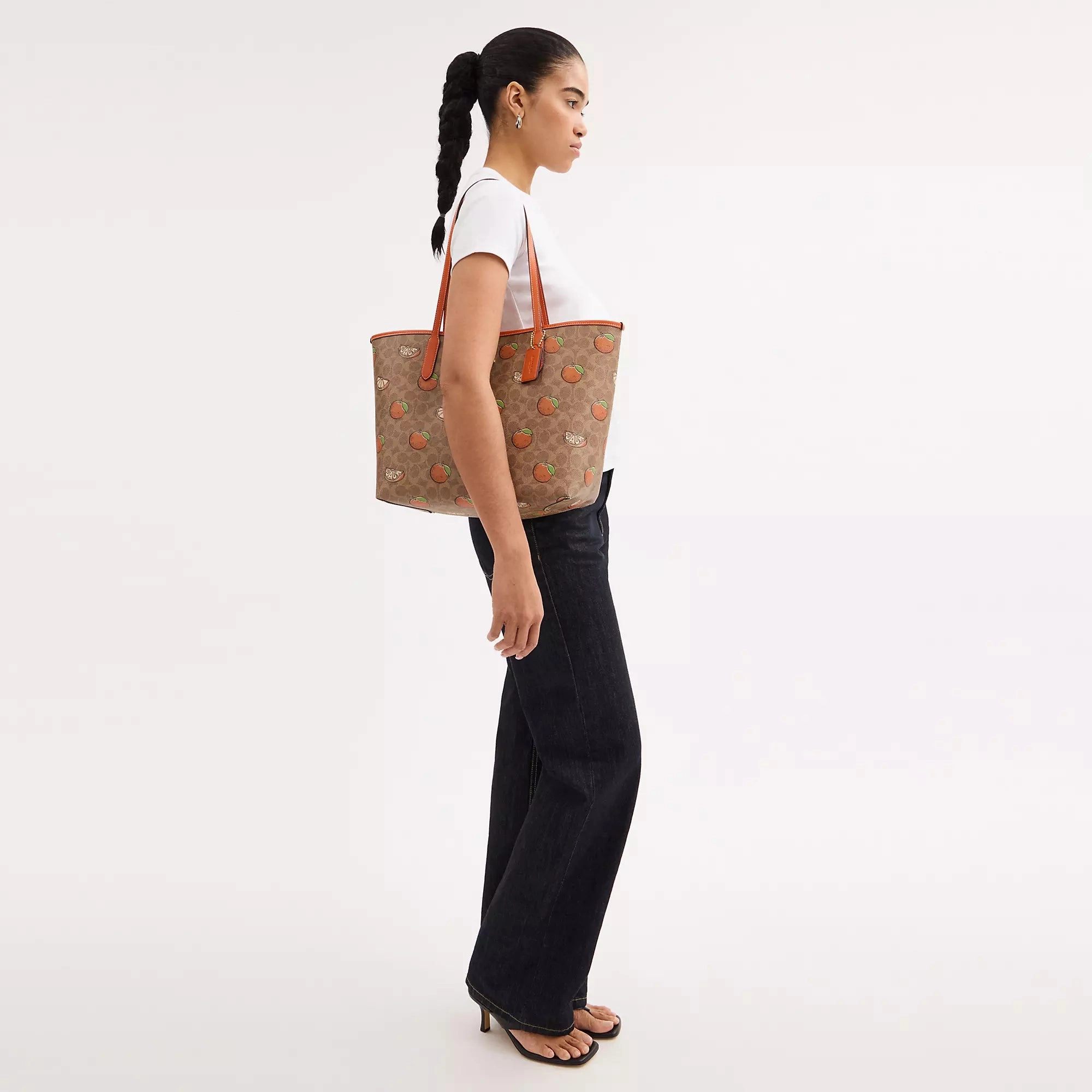 Coach Outlet City Tote Bag In Signature Canvas With Orange Print