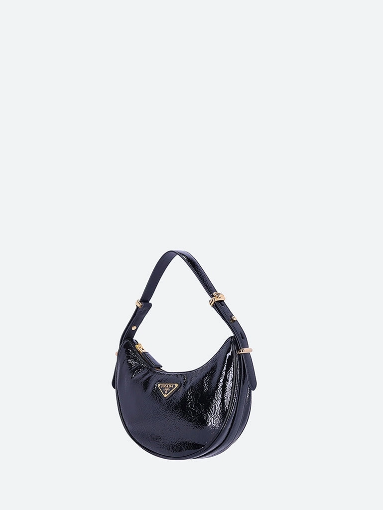 Leather arqu patent handbag