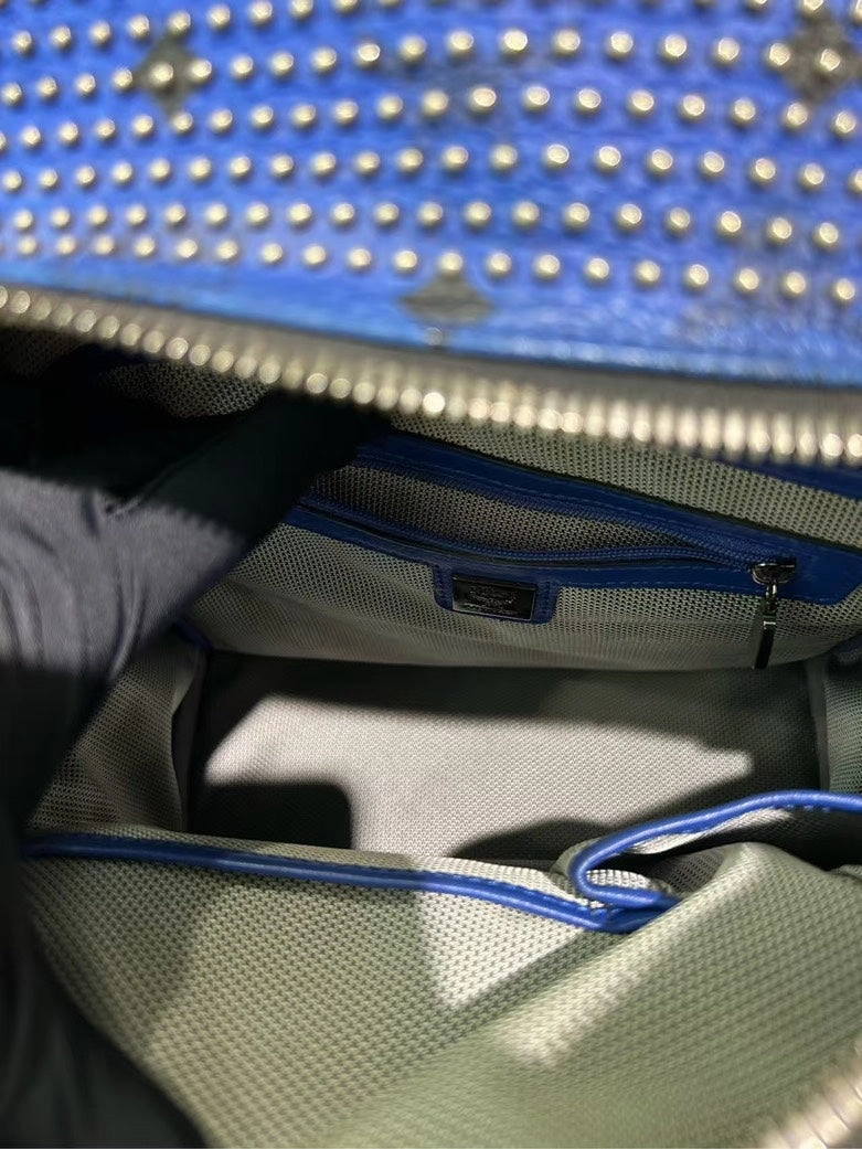 Pre-loved MCM Stark Studded Blue Leather Backpack